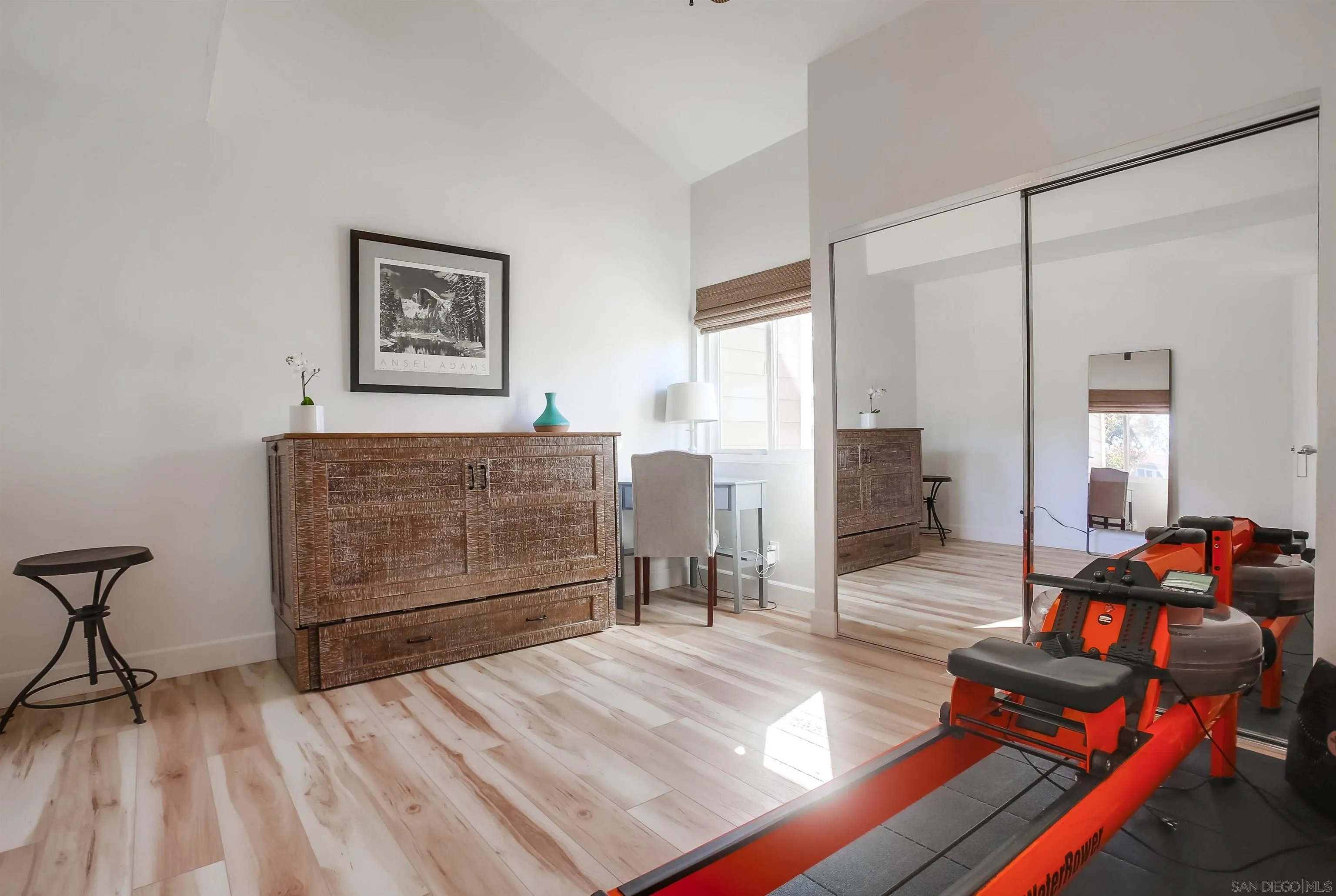 1709 Kennington Road Encinitas, CA 92024 - Photo 16 of 25 a bedroom with a bed and wooden floor