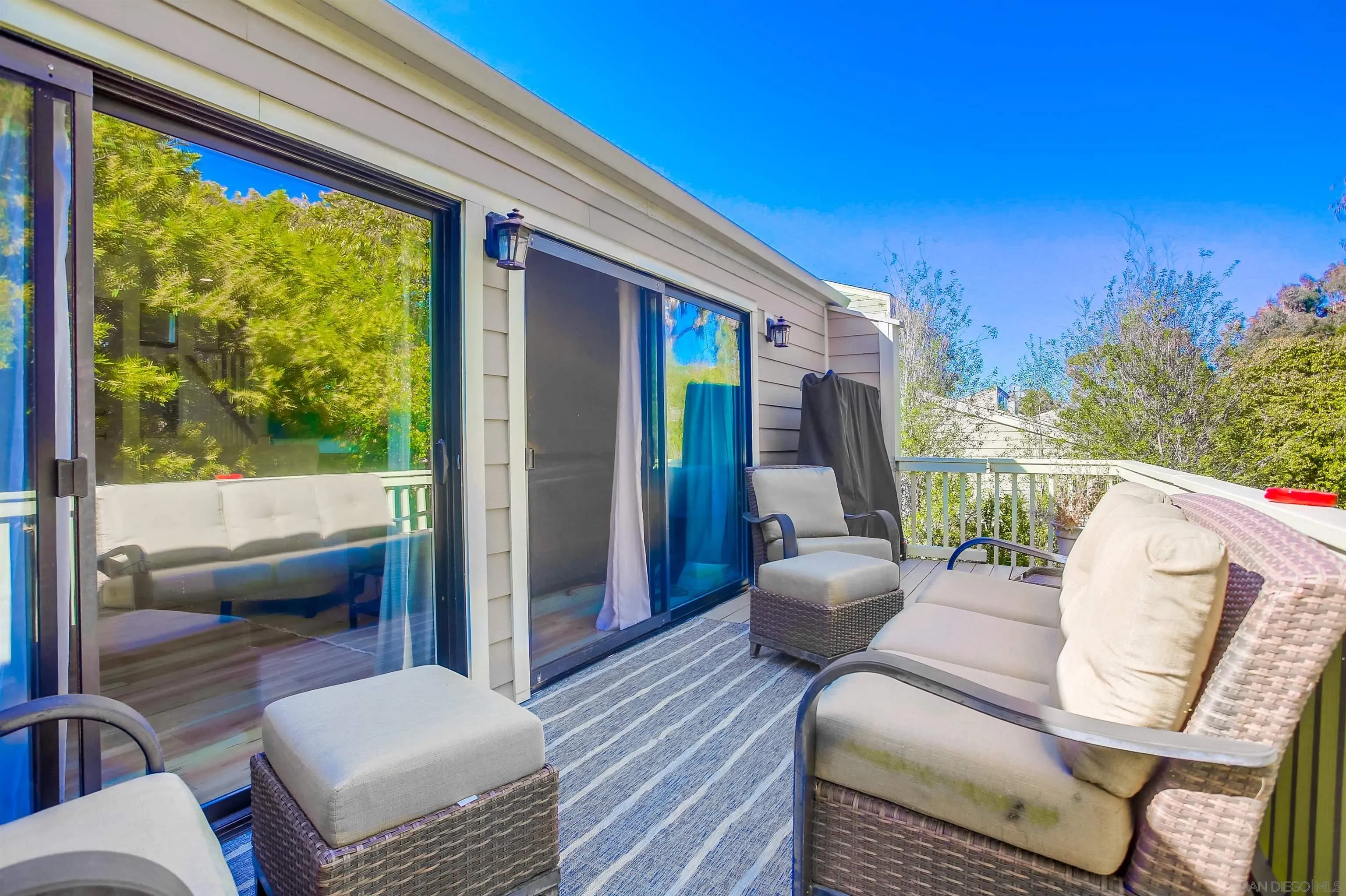 1709 Kennington Road Encinitas, CA 92024 - Photo 18 of 25 a balcony view with a couch and wooden floor