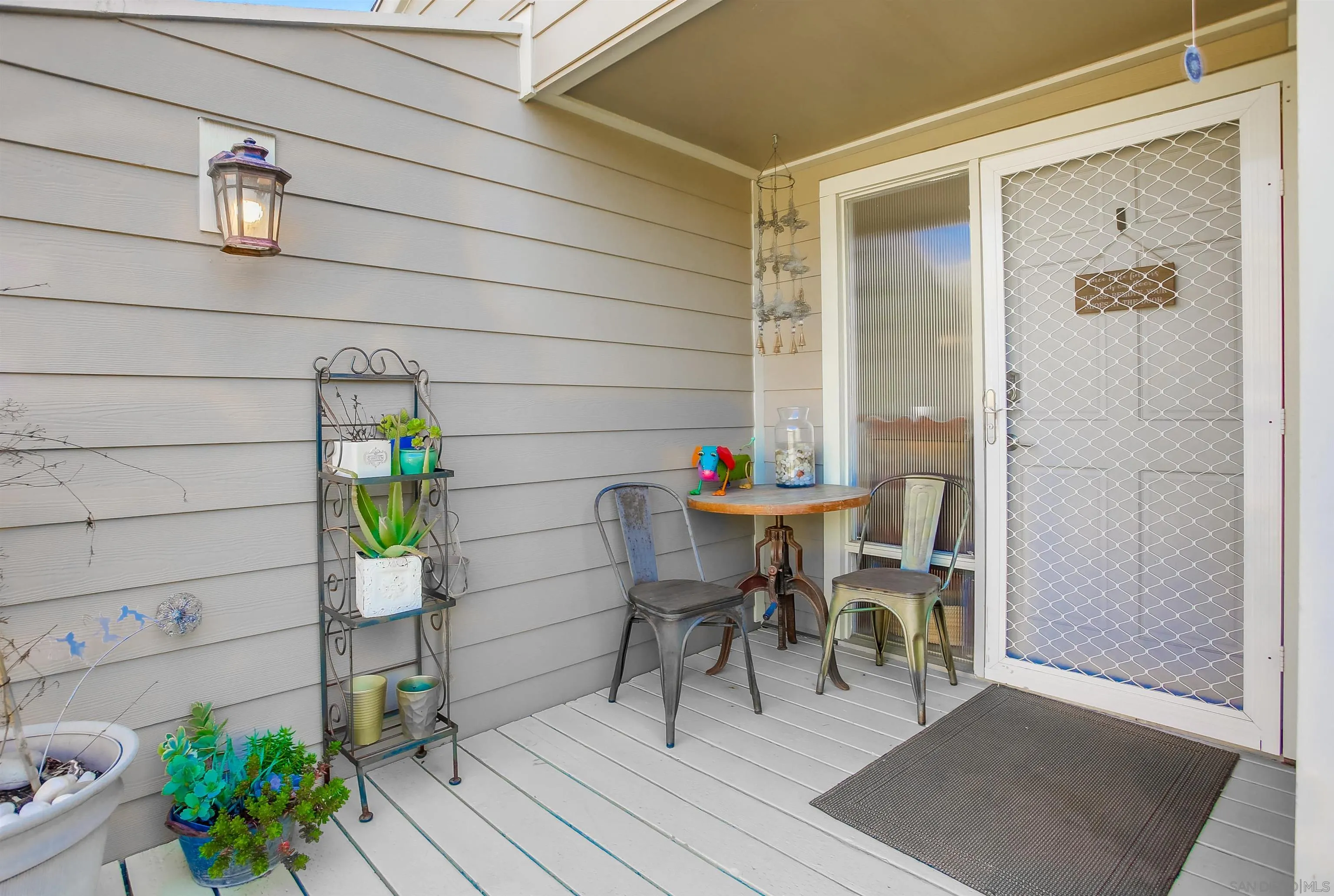 1709 Kennington Road Encinitas, CA 92024 - Photo 21 of 25 a dining room with furniture and a potted plant
