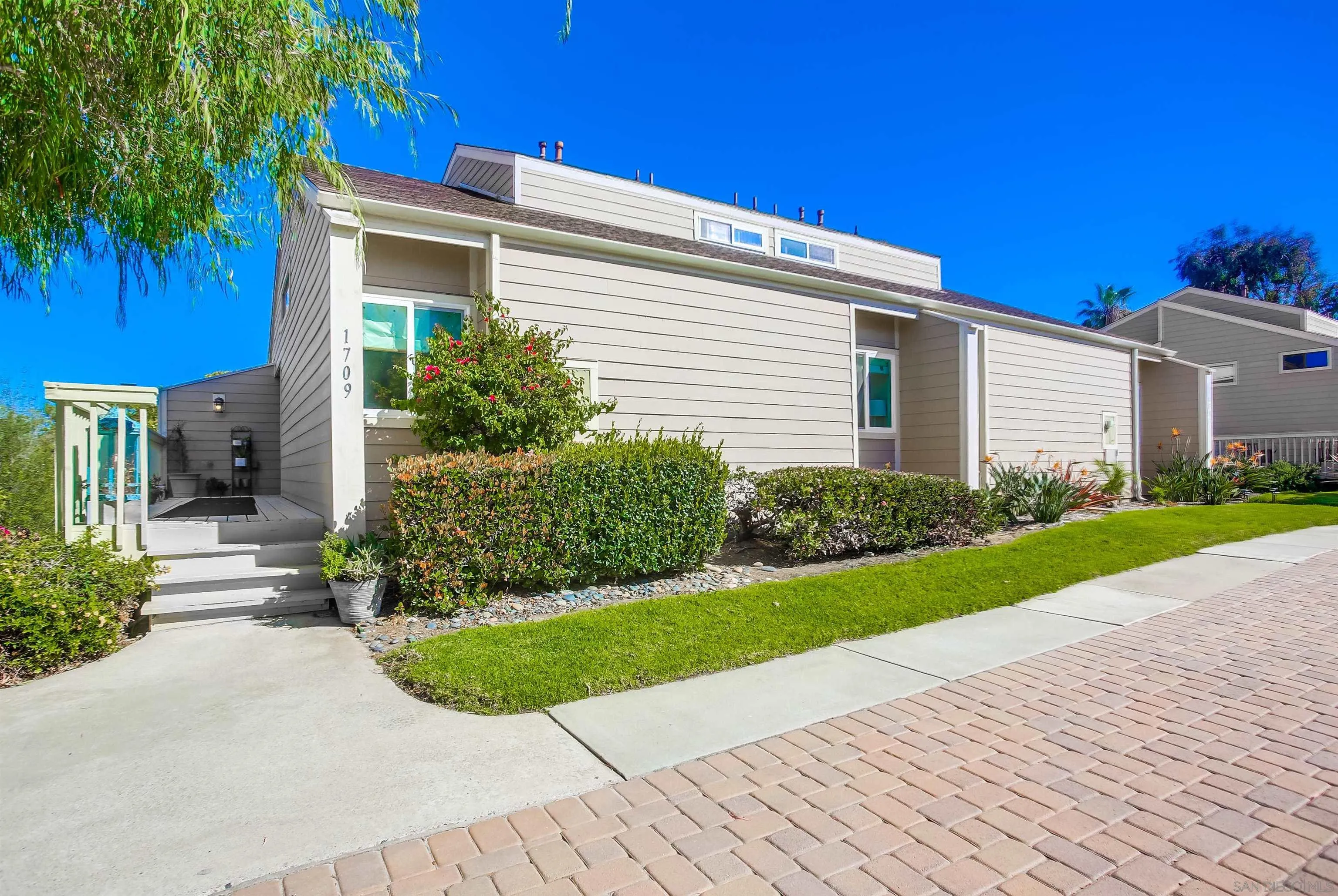 1709 Kennington Road Encinitas, CA 92024 - Photo 24 of 25 a view of a house with a yard