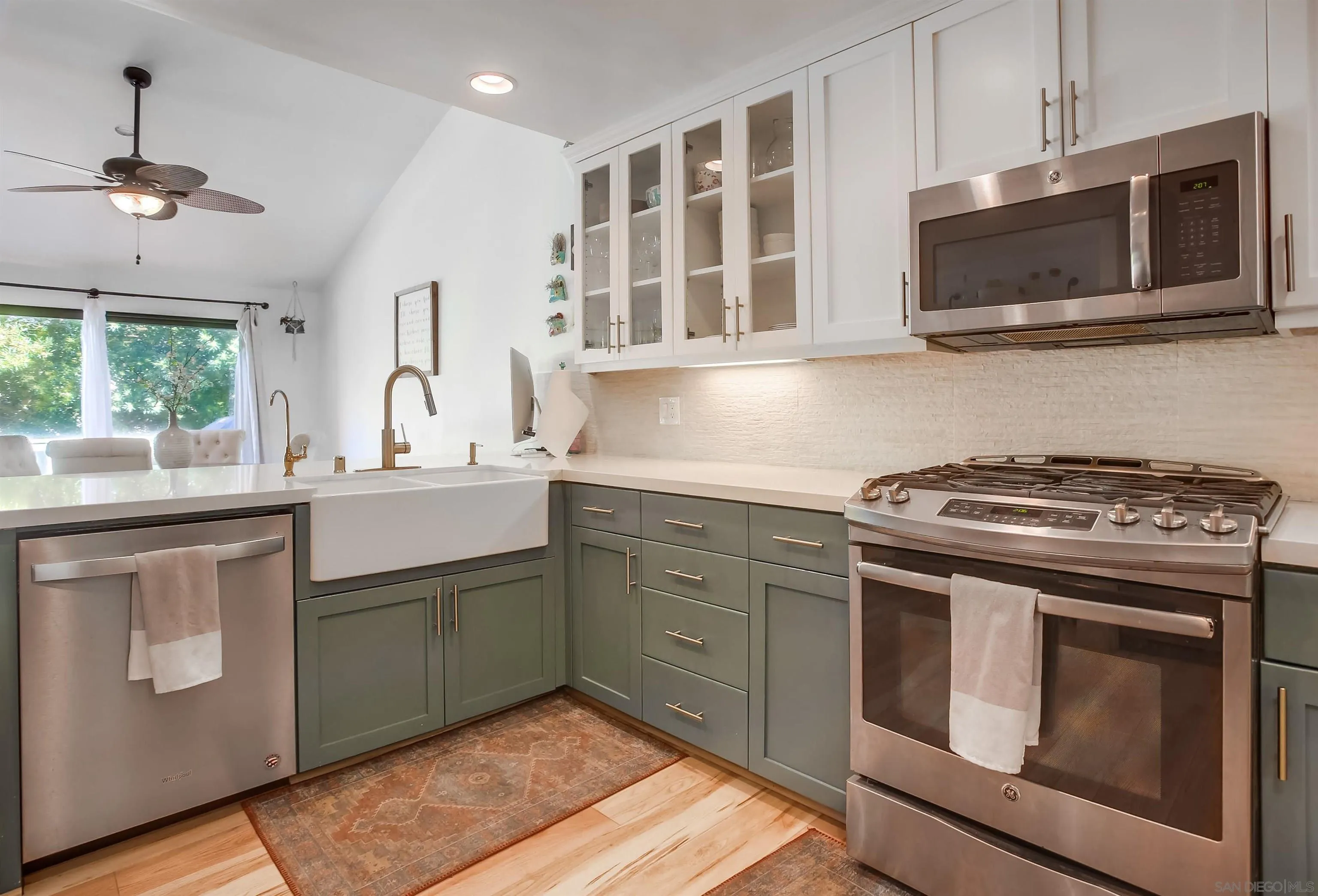 1709 Kennington Road Encinitas, CA 92024 - Photo 6 of 25 a kitchen with a stove and a microwave