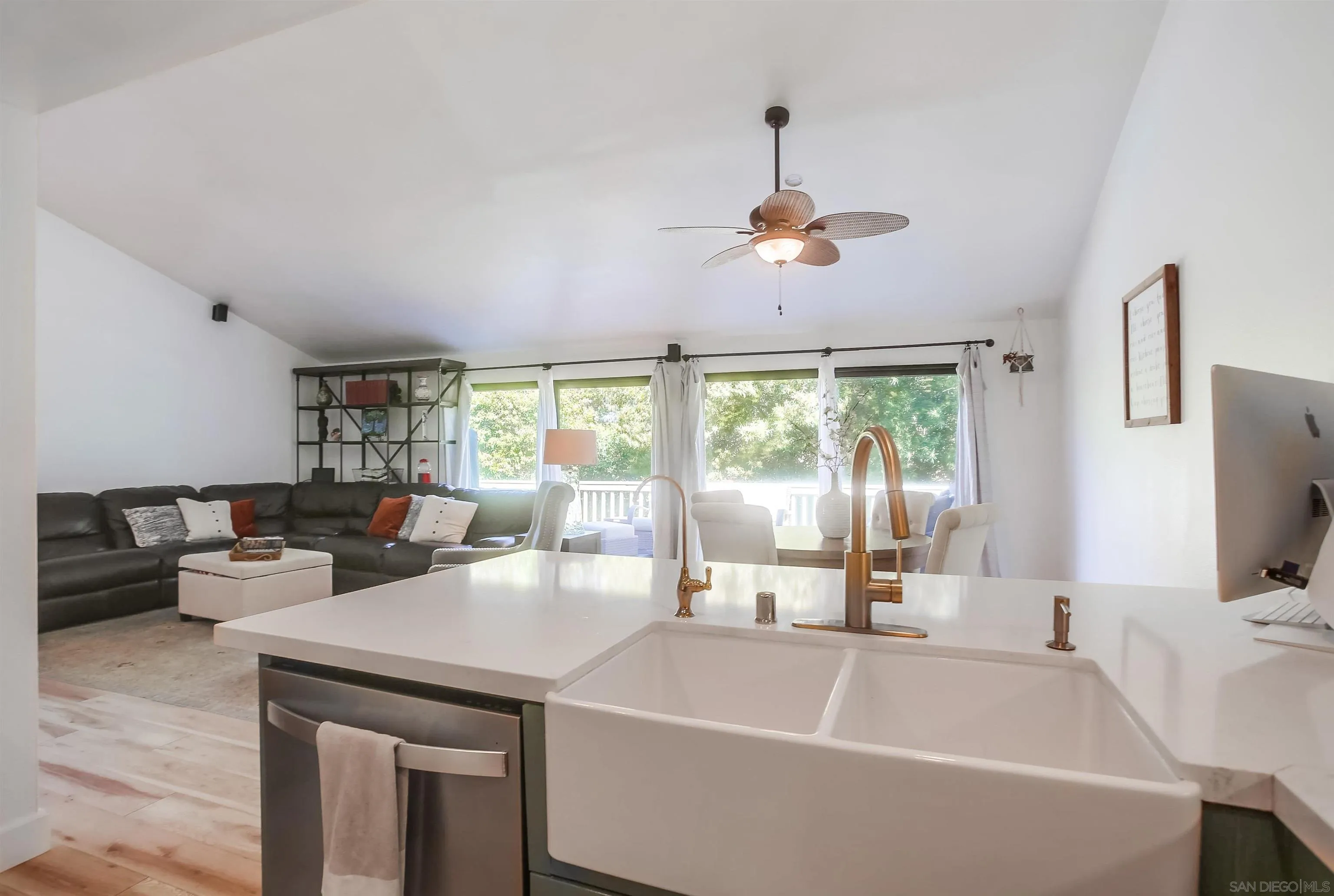 1709 Kennington Road Encinitas, CA 92024 - Photo 7 of 25 a living room with furniture and a flat screen tv