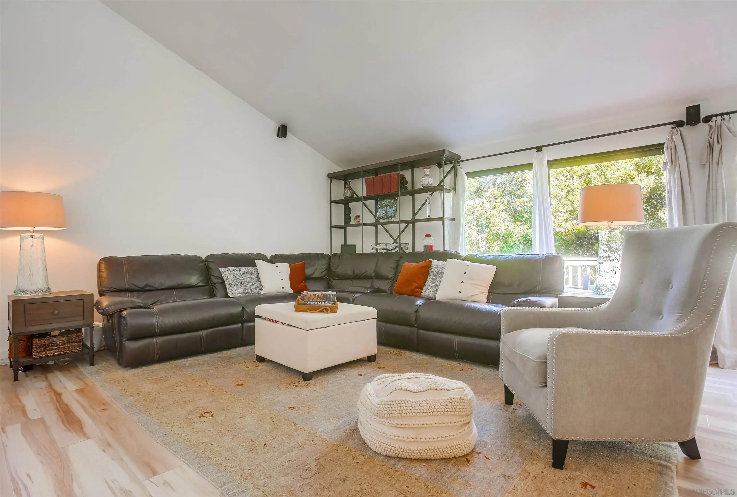 1709 Kennington Road Encinitas, CA 92024 - Photo 10 of 25 a living room with furniture and a large window