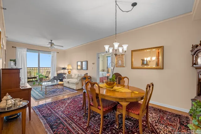 a living room with lots of furniture and a chandelier