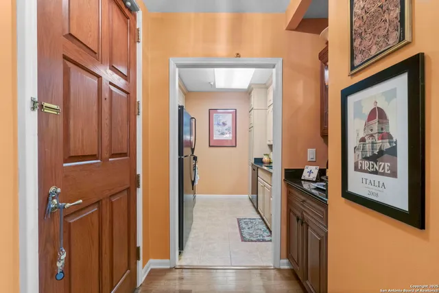 a living room with furniture a rug and a window