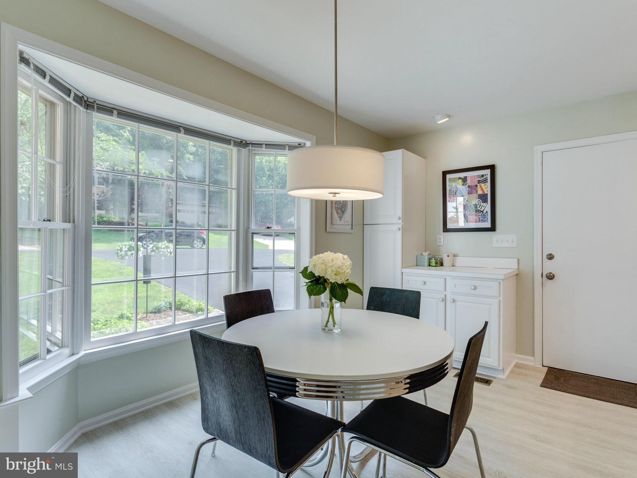 1802 Batten Hollow Road Vienna, VA 22182 - Photo 11 of 30 a view of a dining room with furniture window and outside view