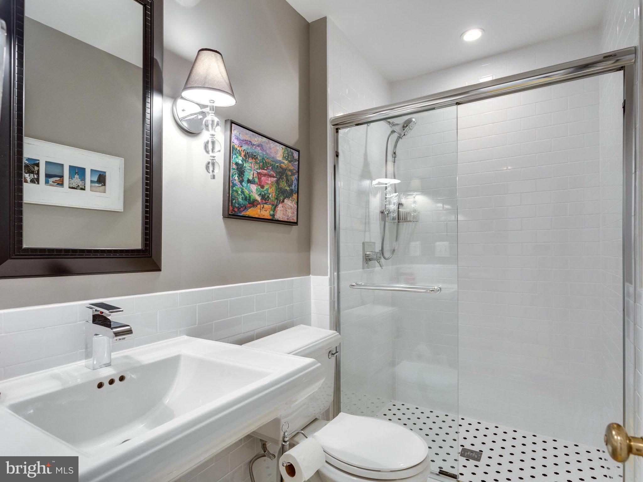 1802 Batten Hollow Road Vienna, VA 22182 - Photo 16 of 30 a bathroom with a sink toilet and shower