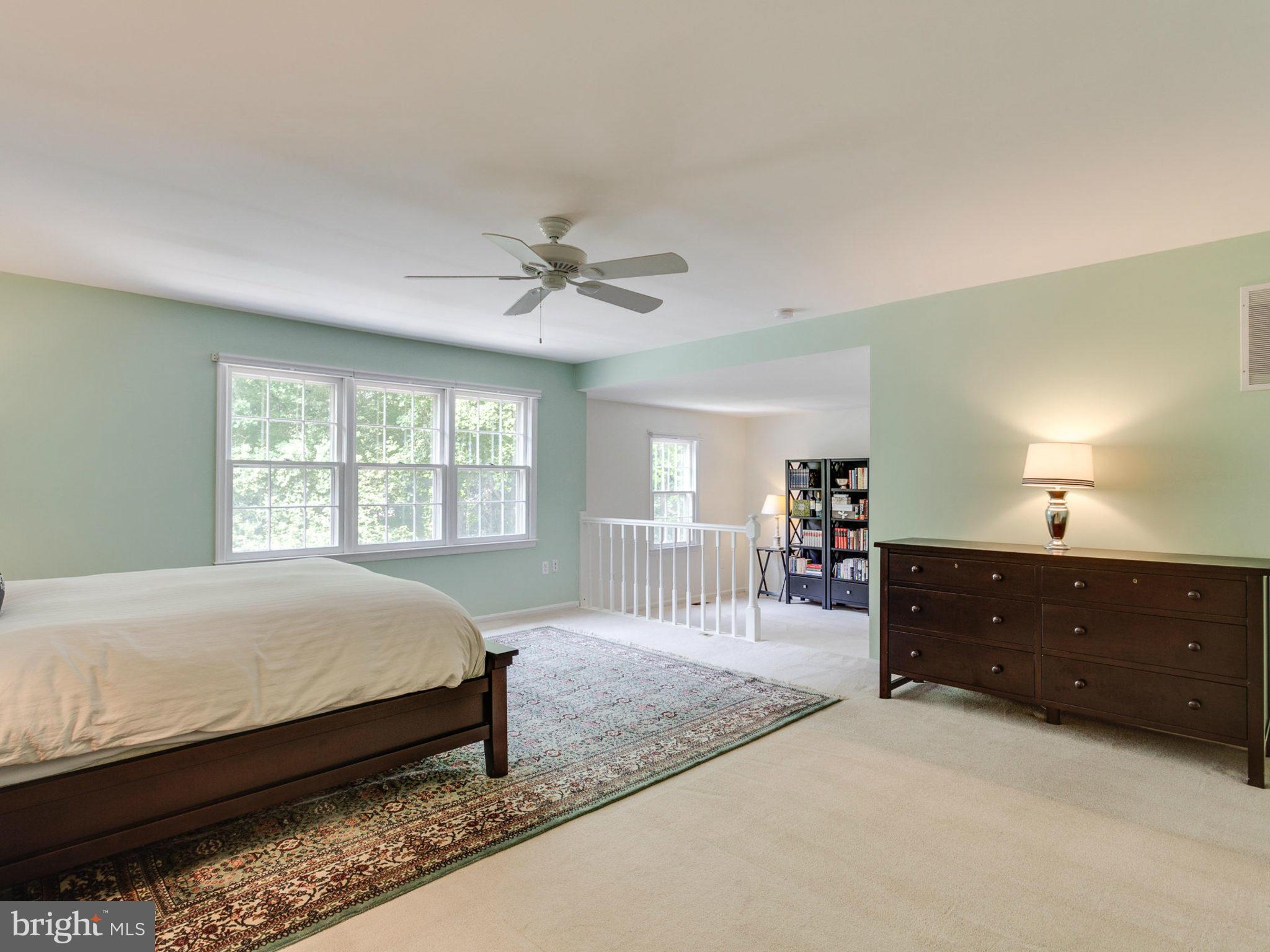 1802 Batten Hollow Road Vienna, VA 22182 - Photo 18 of 30 a bedroom with a bed and a dresser