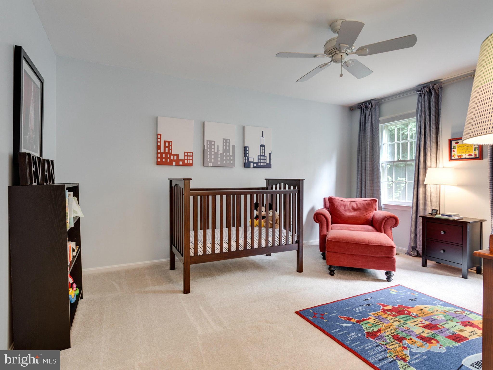 1802 Batten Hollow Road Vienna, VA 22182 - Photo 20 of 30 a bedroom with furniture and a chandelier