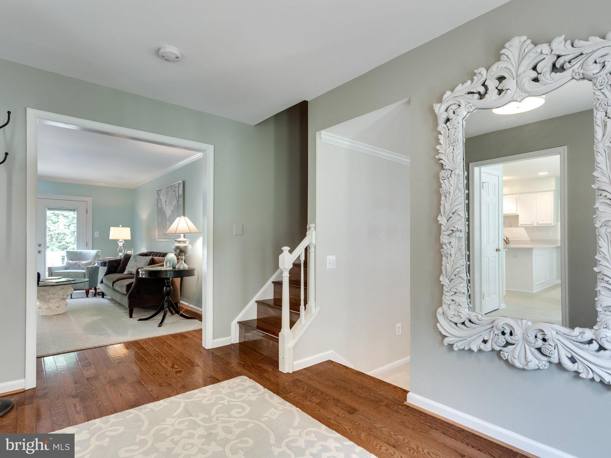 1802 Batten Hollow Road Vienna, VA 22182 - Photo 3 of 30 a living room with furniture and wooden floor