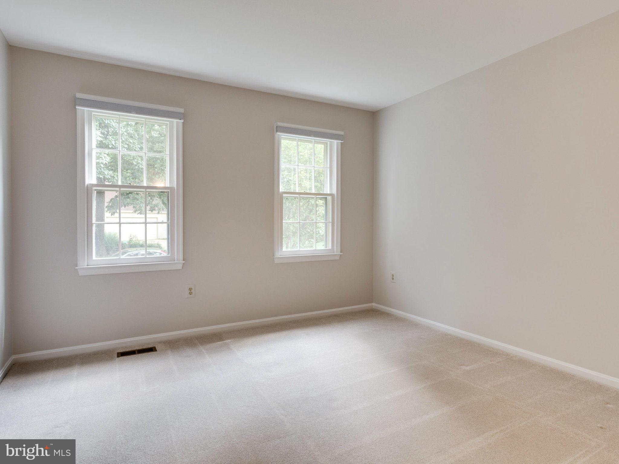 1802 Batten Hollow Road Vienna, VA 22182 - Photo 22 of 30 an empty room with windows