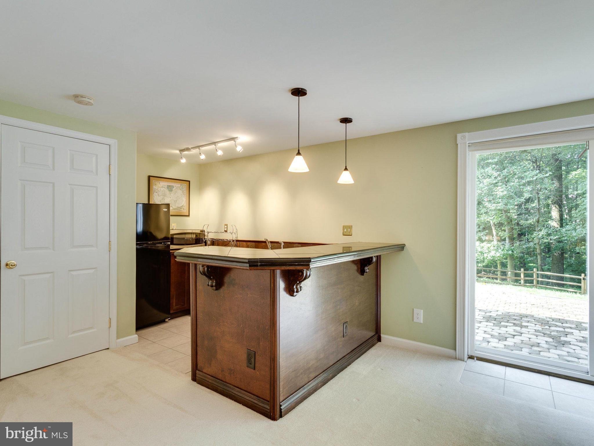 1802 Batten Hollow Road Vienna, VA 22182 - Photo 24 of 30 a open kitchen with a sink and refrigerator