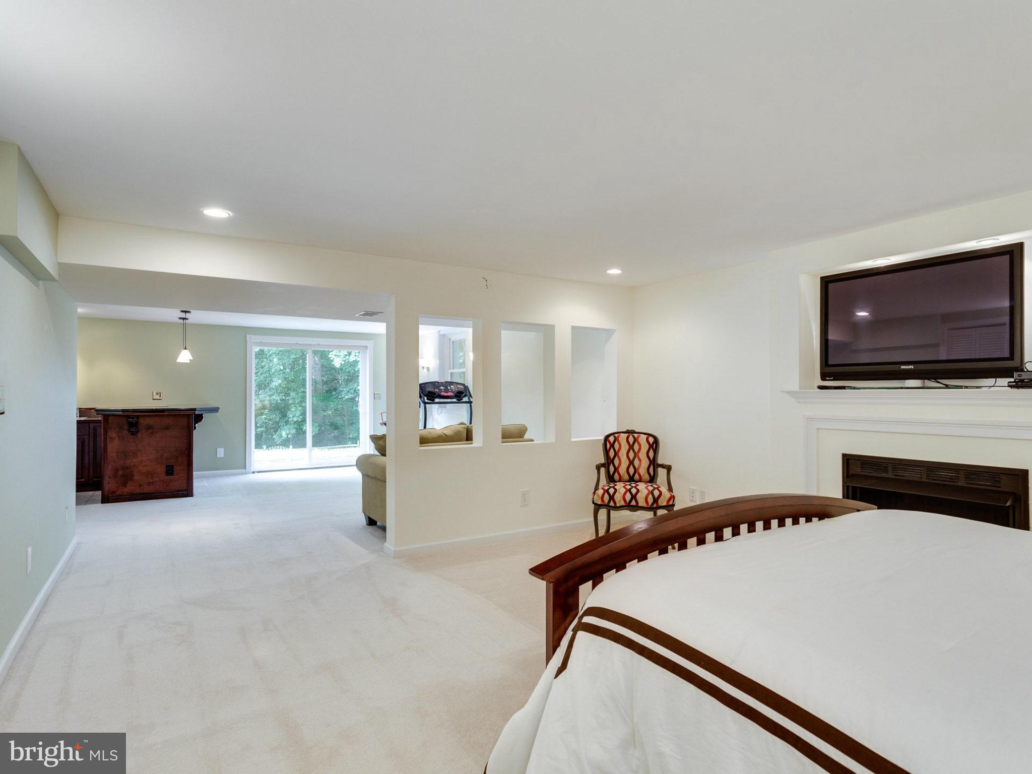 1802 Batten Hollow Road Vienna, VA 22182 - Photo 25 of 30 a room with furniture a flat screen tv and a couch