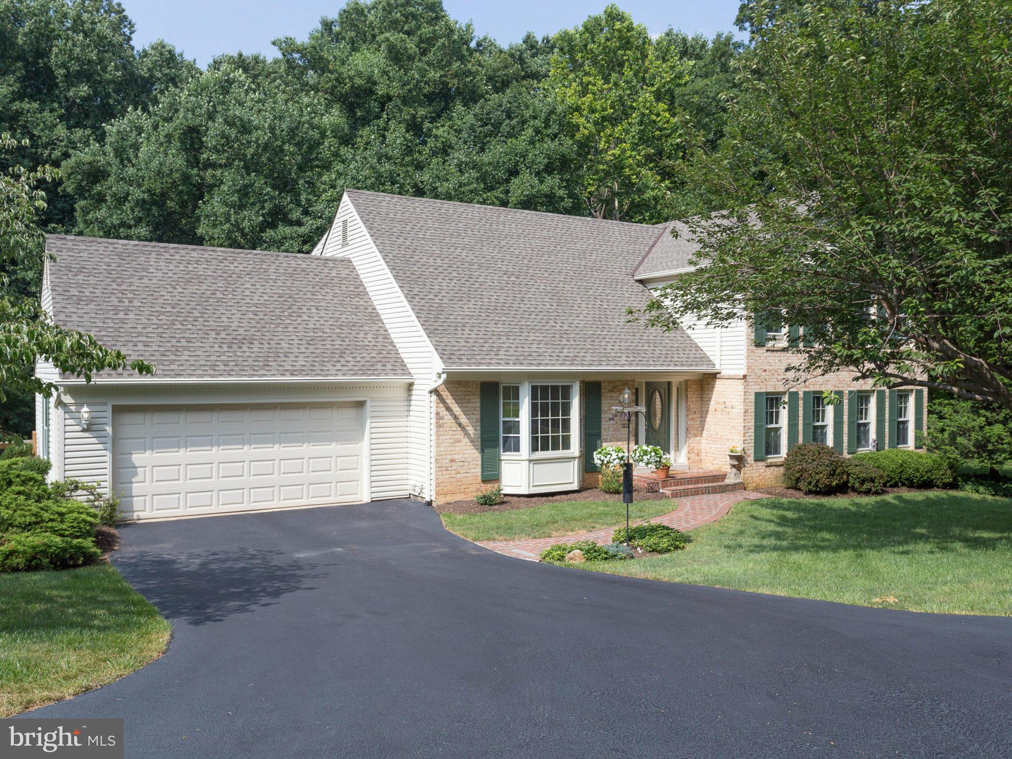 1802 Batten Hollow Road Vienna, VA 22182 - Photo 30 of 30 a front view of a house with a yard and garage