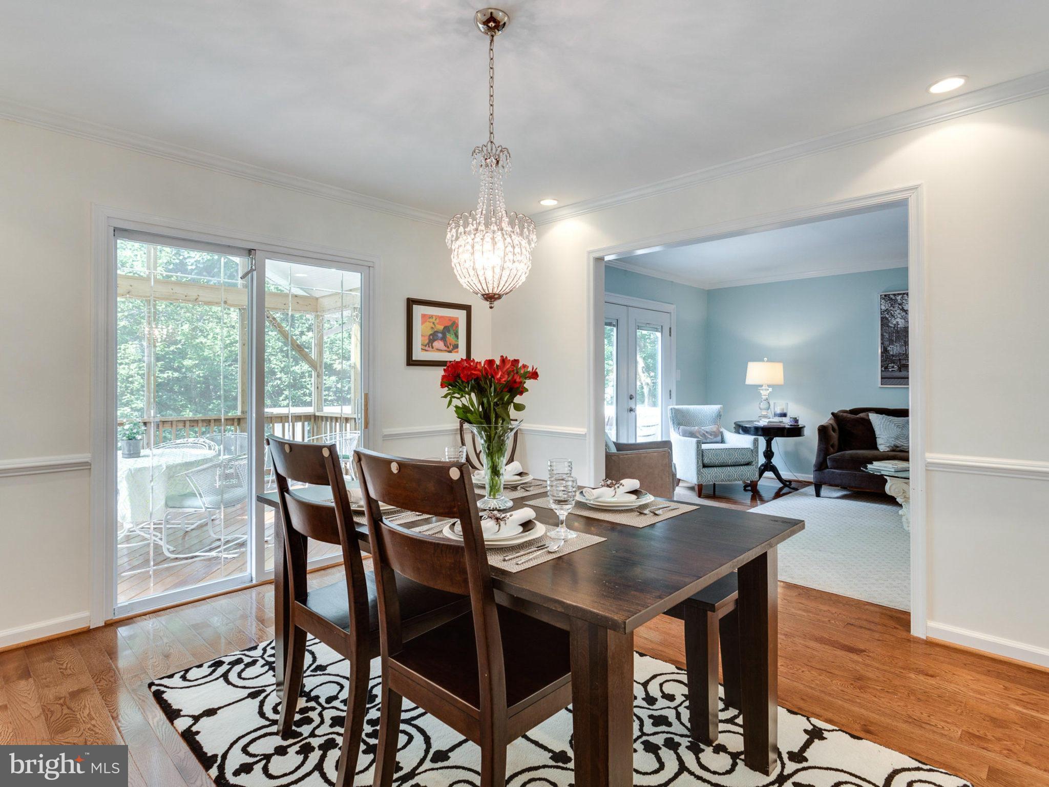 1802 Batten Hollow Road Vienna, VA 22182 - Photo 6 of 30 a view of a dining room with furniture window and wooden floor