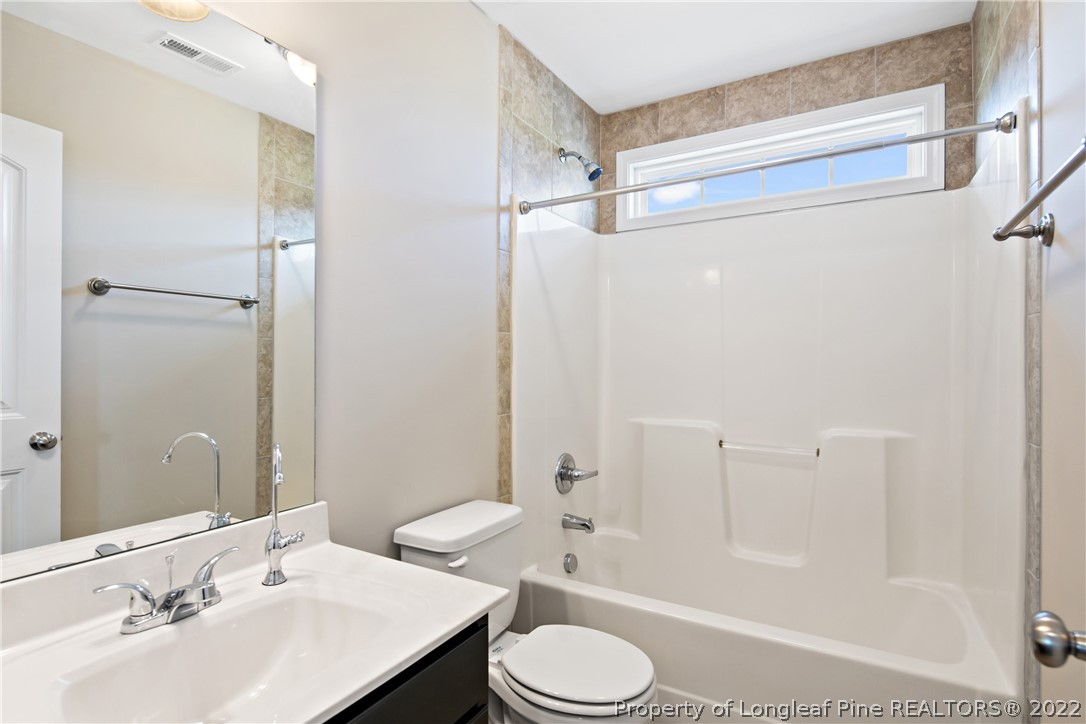 3700 Thrower Road Hope Mills, NC 28348 - Photo 30 of 37 a bathroom with a sink toilet and shower