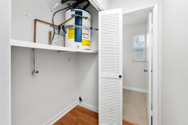 a view of hallway with bathroom