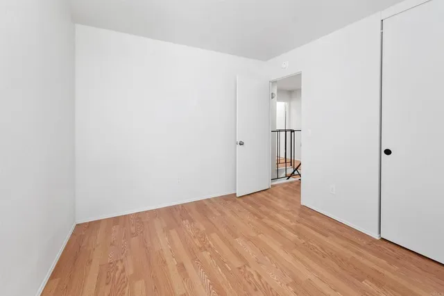 a view of a patio with a table and chairs