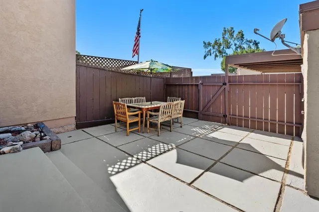 a view of a backyard with sitting area