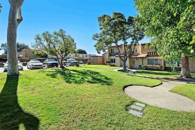 a view of an house with backyard porch and sitting area