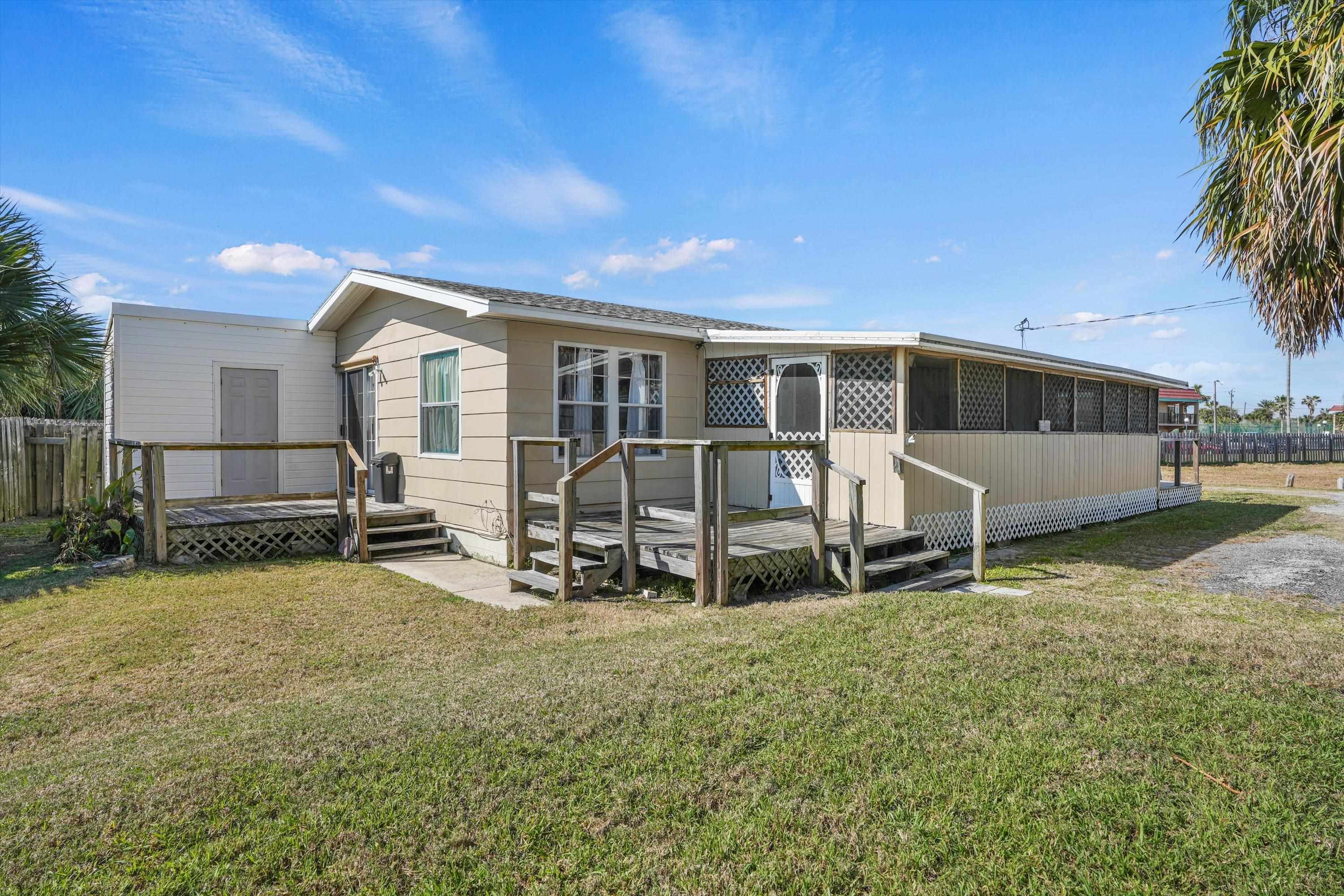 145 Gassett Road St. Augustine, FL 32080 - Photo 14 of 25 a view of a house with backyard sitting area and garden