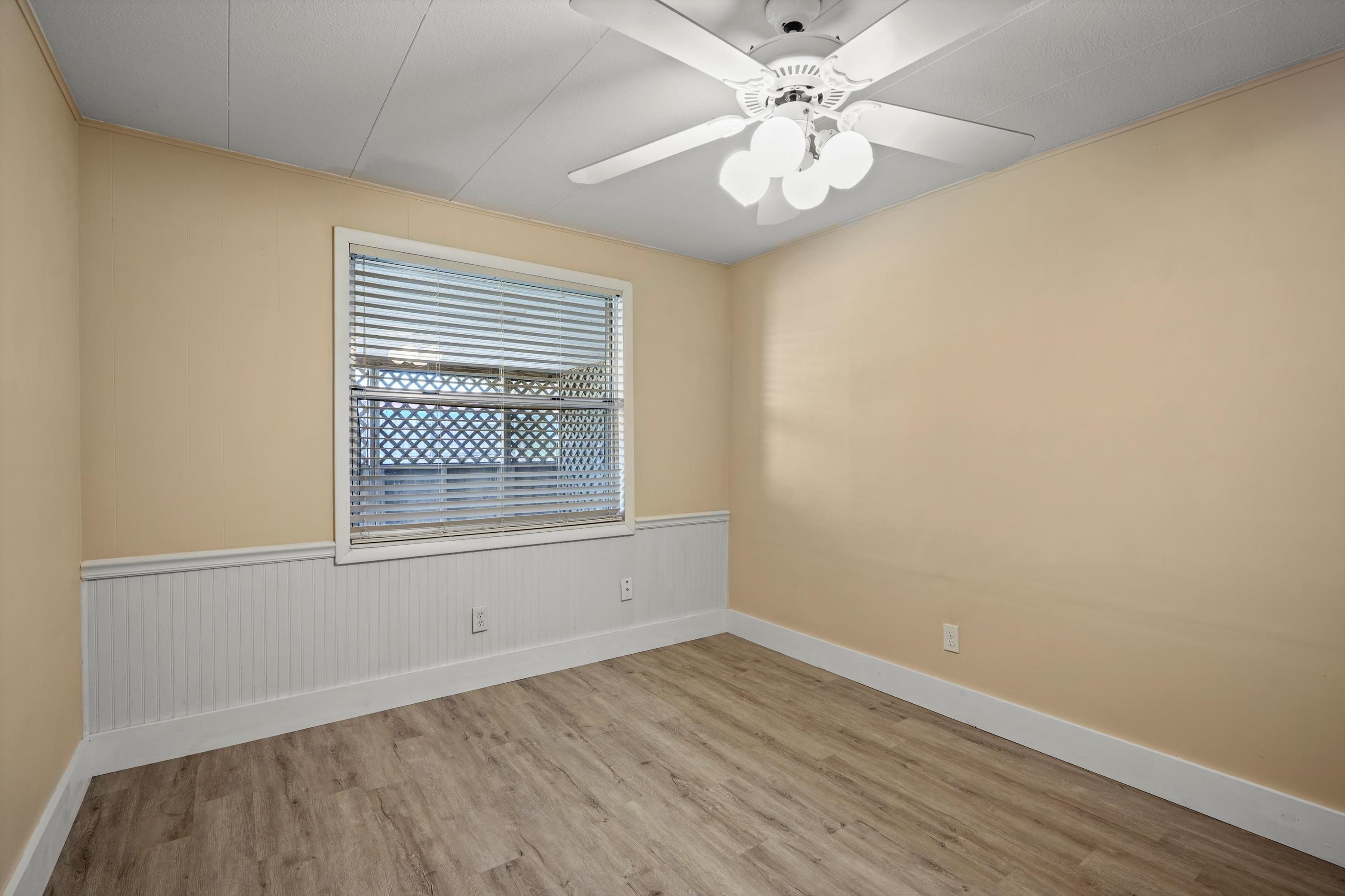 145 Gassett Road St. Augustine, FL 32080 - Photo 19 of 25 wooden floor in an empty room with a window
