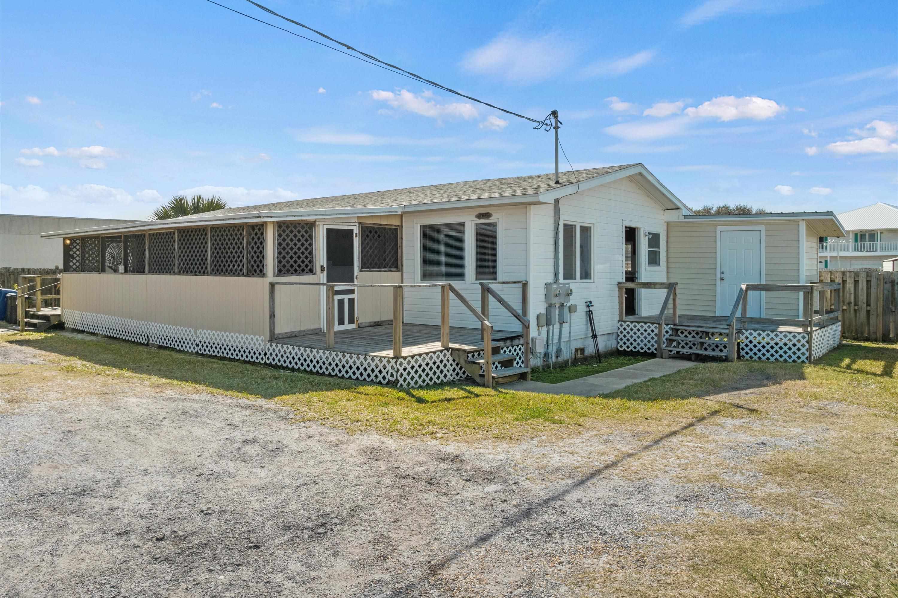 145 Gassett Road St. Augustine, FL 32080 - Photo 2 of 25 a view of a house with swimming pool and sitting area
