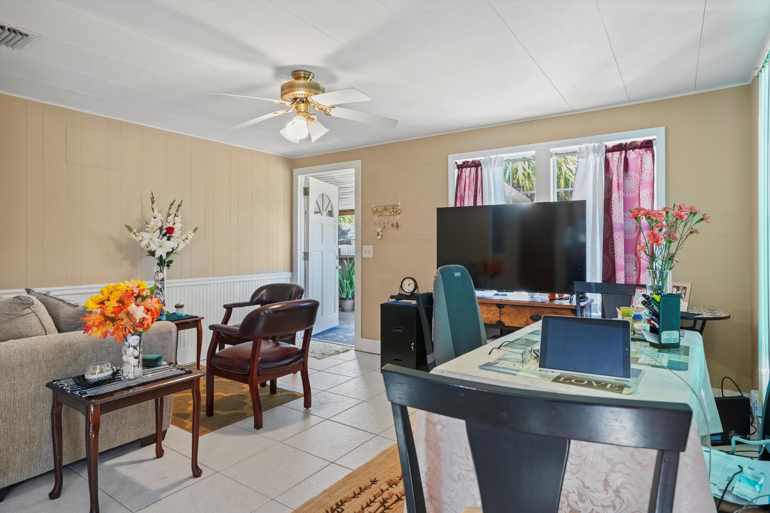 145 Gassett Road St. Augustine, FL 32080 - Photo 6 of 25 a living room with furniture and a flat screen tv