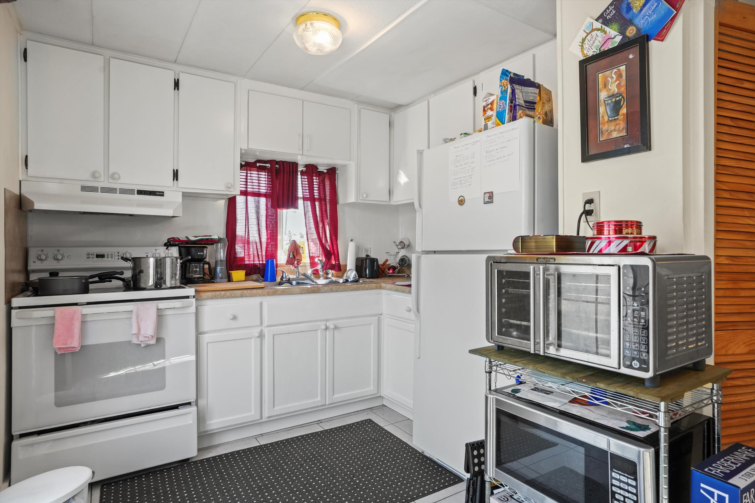 145 Gassett Road St. Augustine, FL 32080 - Photo 7 of 25 a kitchen with stainless steel appliances a stove a sink and cabinets
