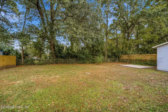 a backyard of a house with trees
