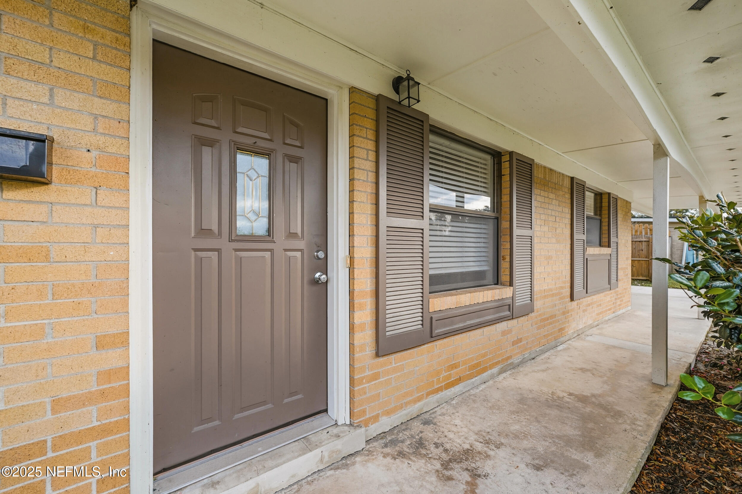 3135 Victoria Park Road Jacksonville, FL 32216 - Photo 2 of 21 a view of a porch with a door and balcony