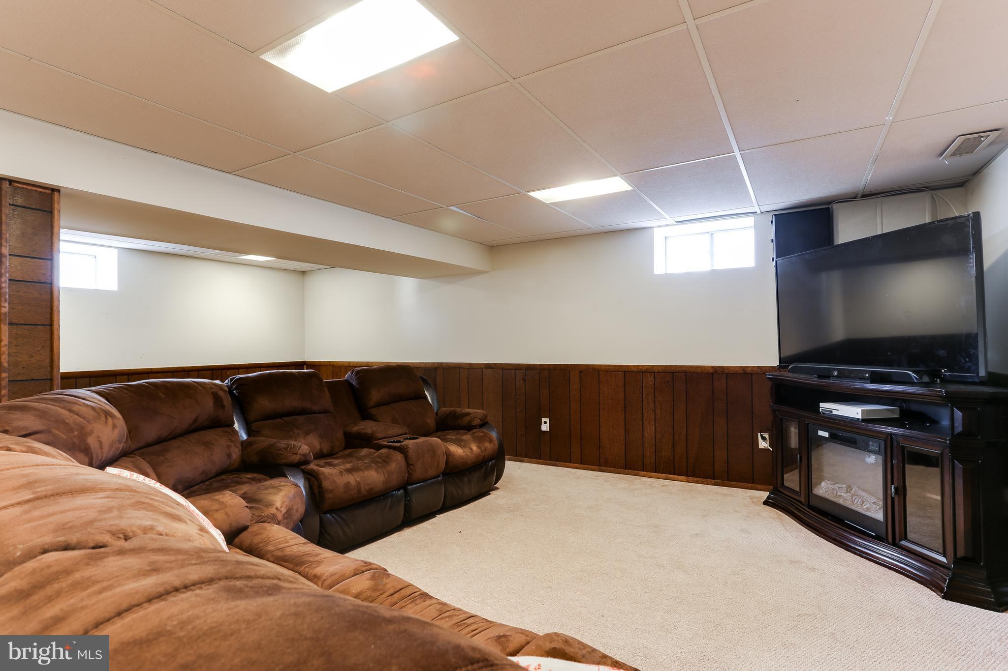 9003 Winands Road Owings Mills, MD 21117 - Photo 25 of 30 a living room with furniture and a flat screen tv