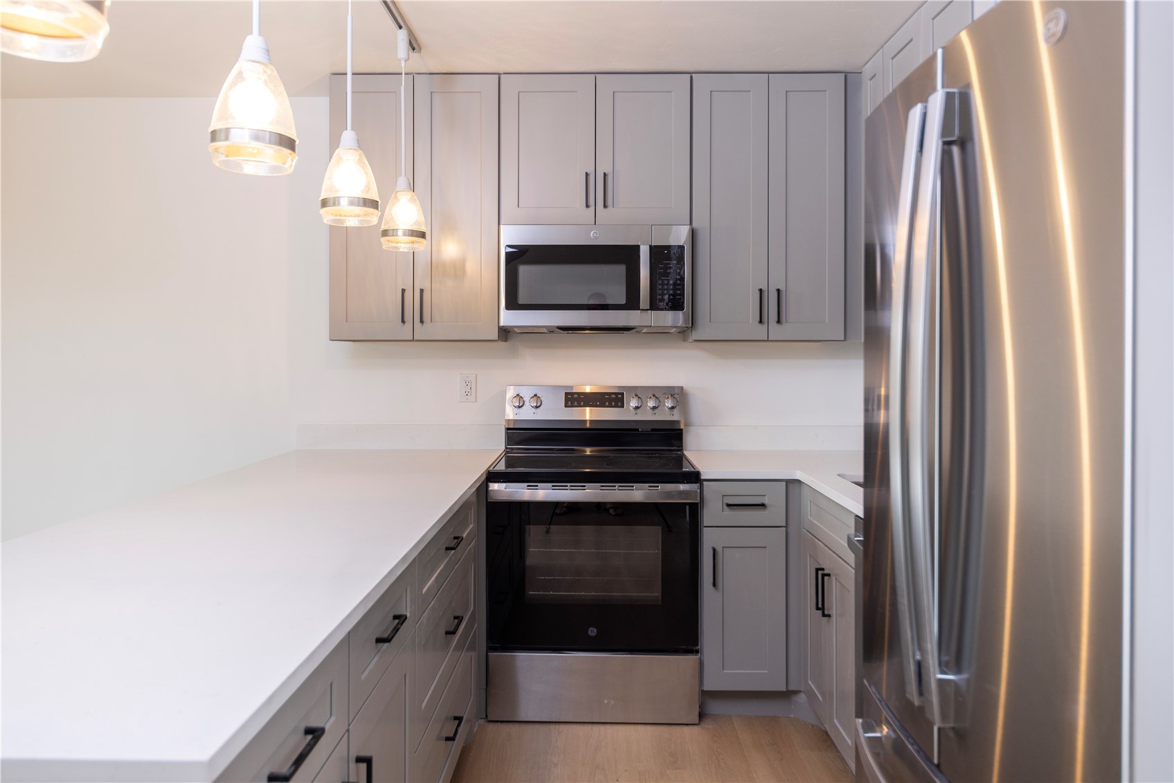 110 Evergreen Road, Unit 303 Dillon, CO 80435 - Photo 3 of 35 a kitchen with stainless steel appliances a stove microwave and refrigerator