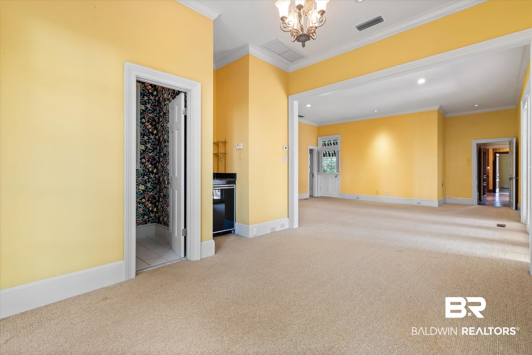 54 Turnin Lane Mobile, AL 36608 - Photo 14 of 35 Carpeted empty room with ornamental molding and an inviting chandelier