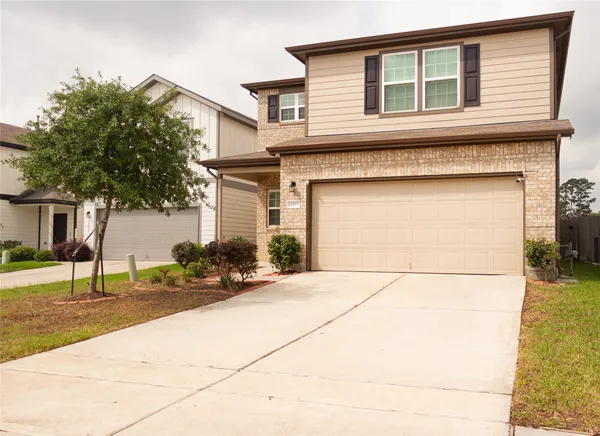 a front view of a house with a garage