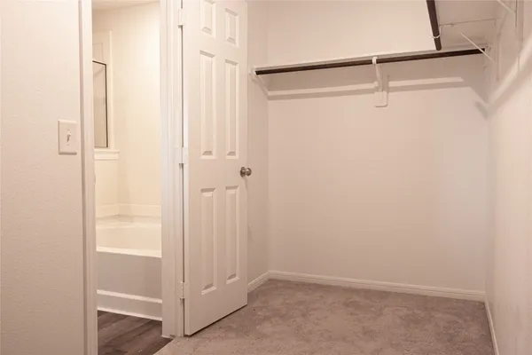 a view of an empty walk in closet