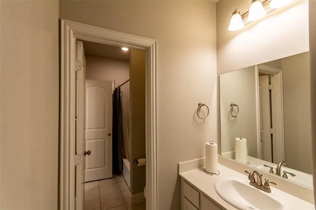 a bathroom with a double vanity sink and mirror