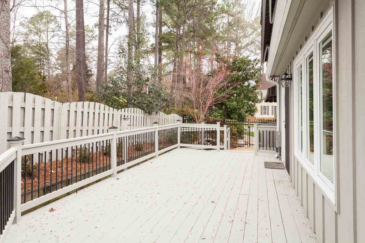 6909 Valley Ridge Court Raleigh, NC 27615 - Photo 24 of 25 Wonderful Huge Deck for Entertaining and has "No Nails." You Will Love the Heated Green House Room that Adjoins. Deck