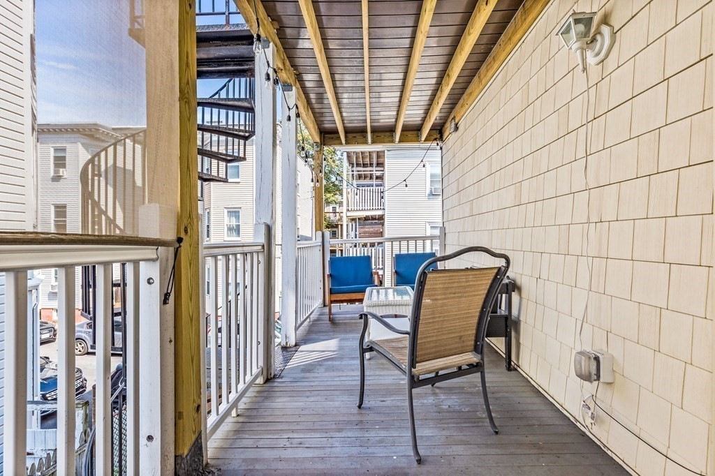 472 East 8th Street, Unit 2 Boston, MA 02127 - Photo 11 of 12 a view of a chair and table in the balcony