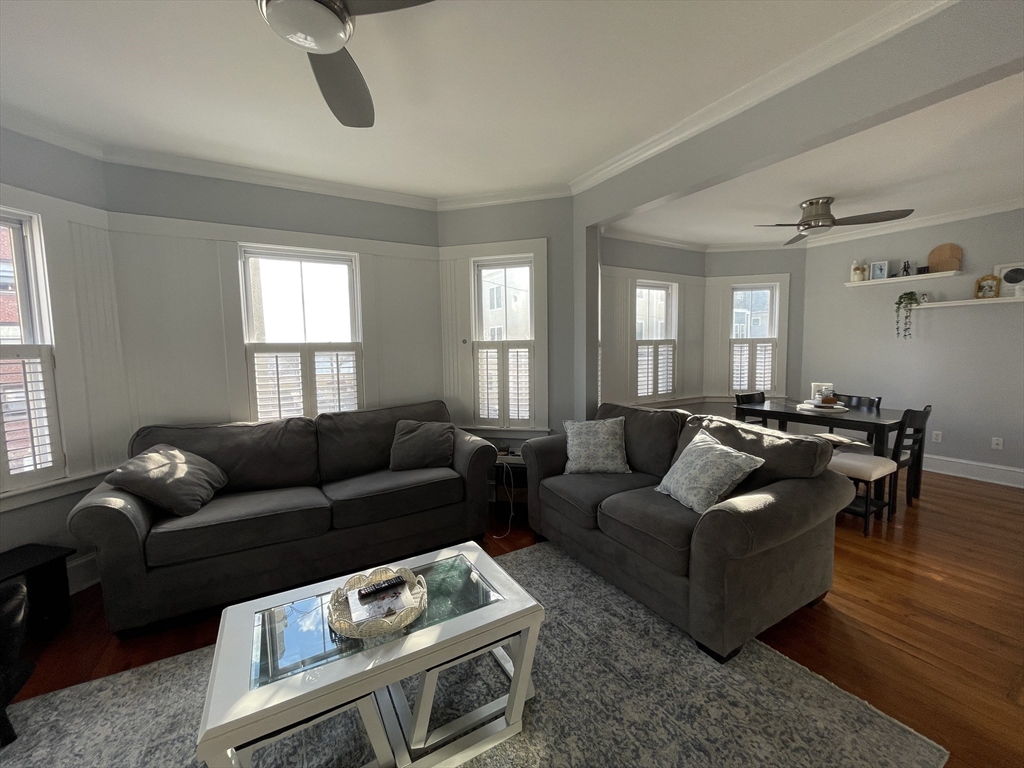 472 East 8th Street, Unit 2 Boston, MA 02127 - Photo 2 of 12 a living room with furniture and wooden floor