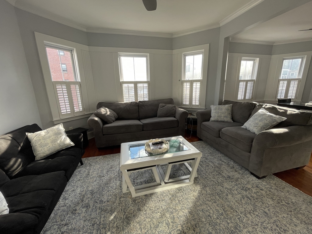 472 East 8th Street, Unit 2 Boston, MA 02127 - Photo 4 of 12 a living room with furniture and a window