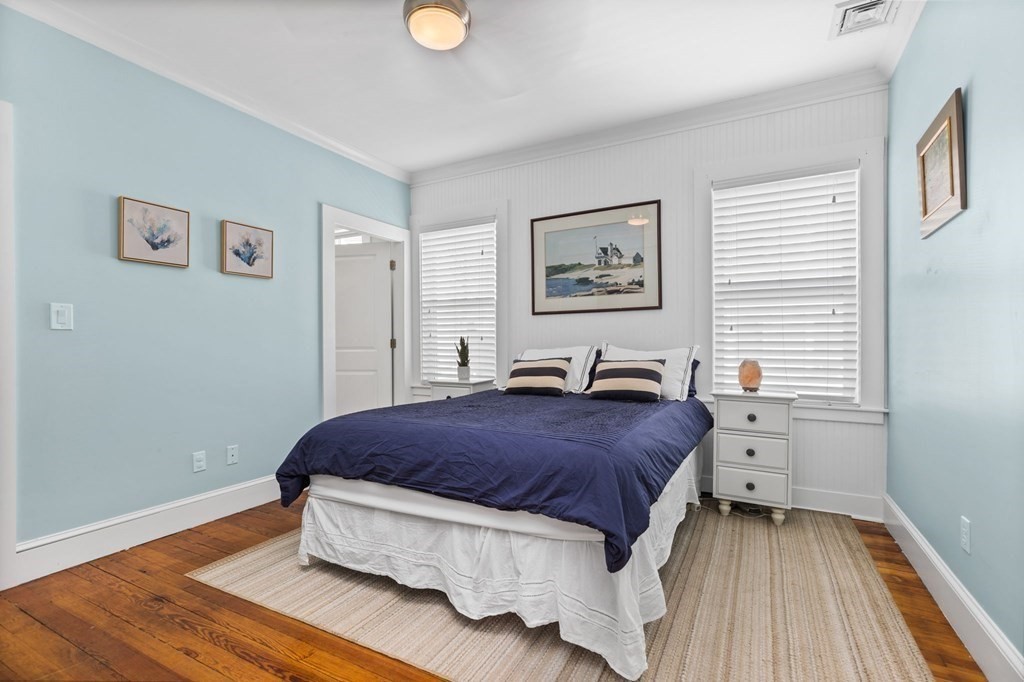 472 East 8th Street, Unit 2 Boston, MA 02127 - Photo 7 of 12 a bedroom with a bed and a window