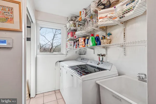 a bathroom with a walk in closet and a bathroom