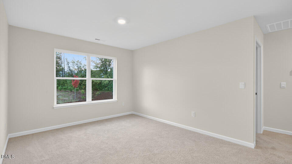 33 Stone Apiary Drive Angier, NC 27501 - Photo 17 of 45 an empty room with a window