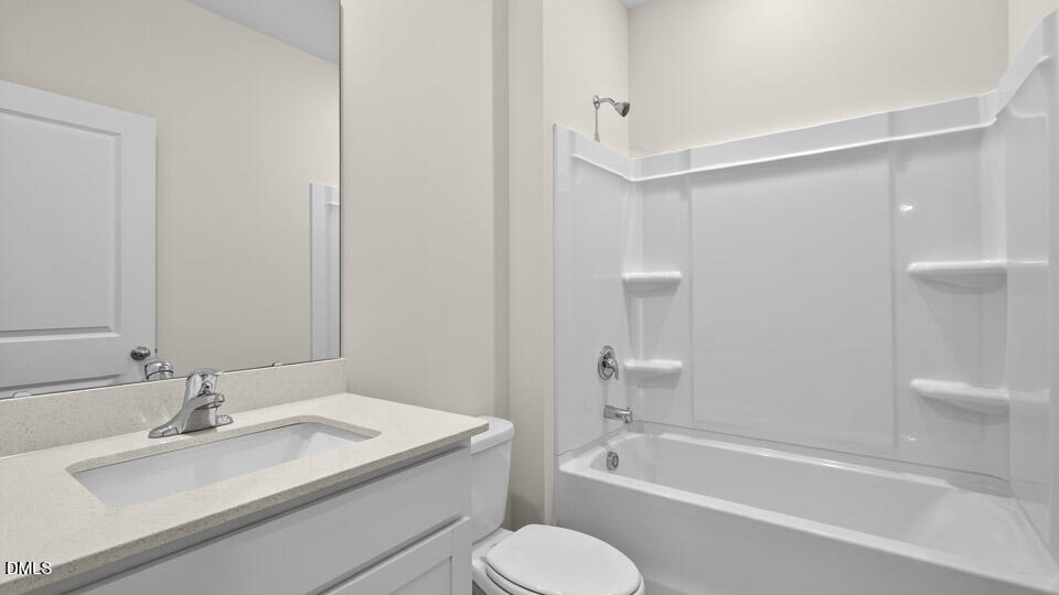33 Stone Apiary Drive Angier, NC 27501 - Photo 31 of 45 a bathroom with a granite countertop sink toilet and shower