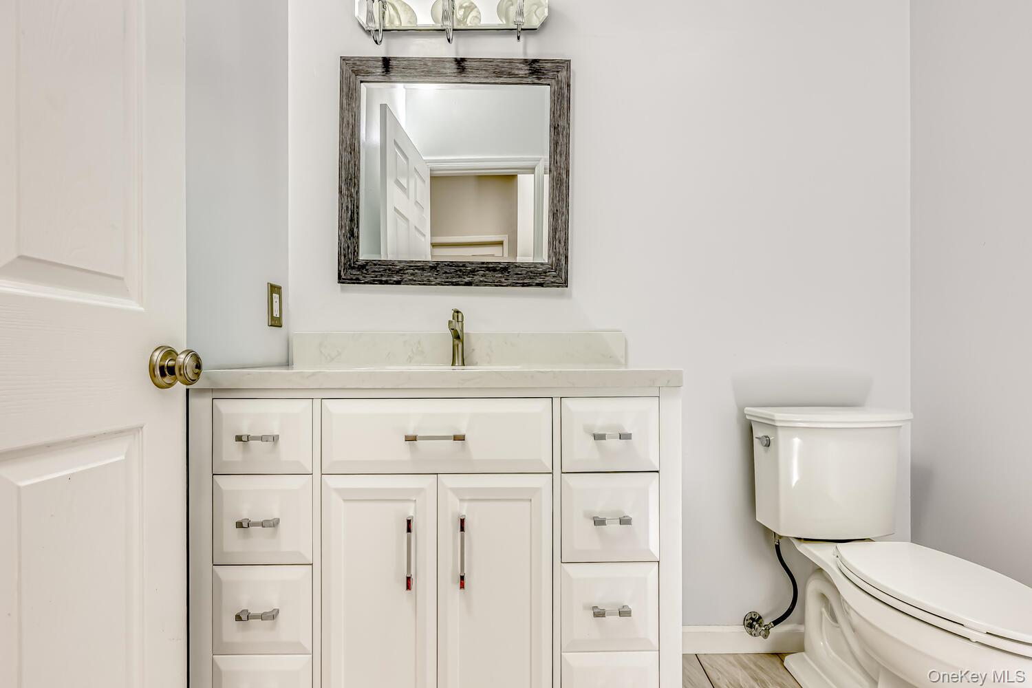 22 Golden Road Suffern, NY 10901 - Photo 19 of 41 Half bathroom featuring vanity and toilet