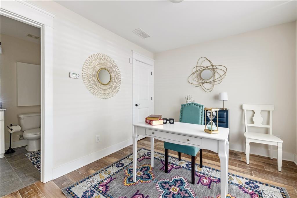 1333 Oakview Road Decatur, GA 30030 - Photo 19 of 28 a room with a table and chairs