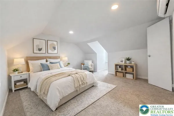 a bedroom with a bed and a chair
