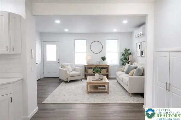 a living room with furniture and a large window
