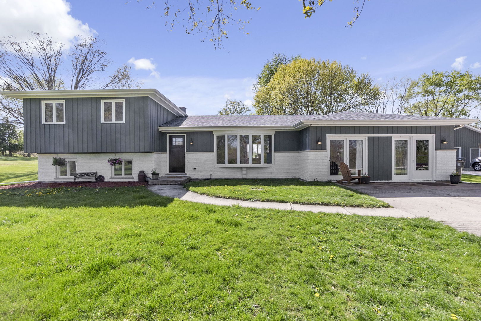S888 Wenmoth Road Batavia, IL 60510 - Photo 1 of 40 a view of a house with a yard patio and a swimming pool